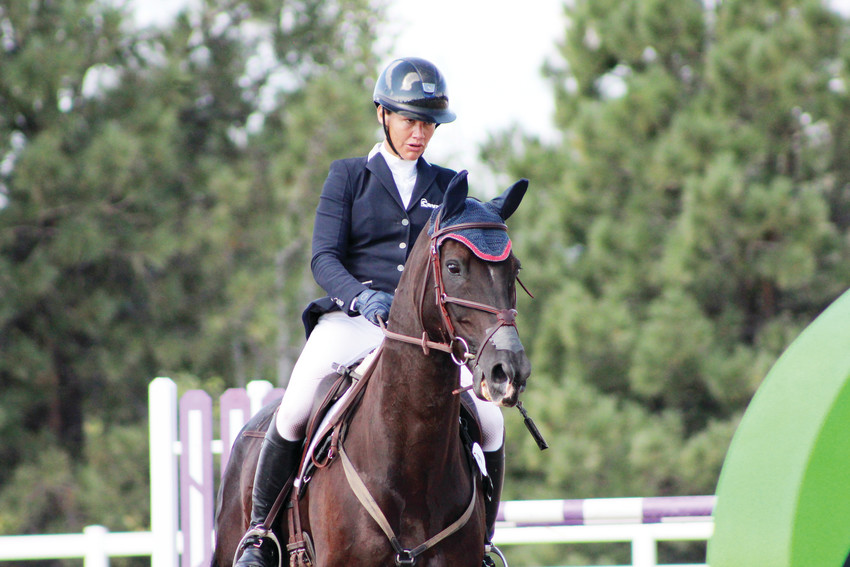 Tamra Smith prepares to clear the final oxer of her championship round in the American Eventing Championship at the Colorado Horse Park Sept. 2. Smith's finish in the final leg, show-jumping, helped her clinch first in the AEC and $20,000 in prize money.