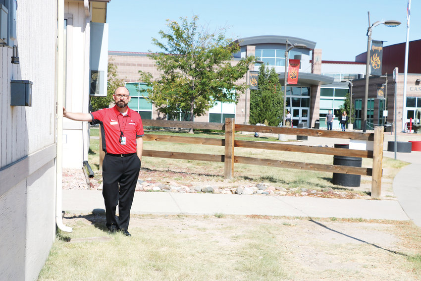 Rex Corr, principal of Castle View High School in Castle Rock, stands next to one of eight mobiles, which are structures that serve as outdoor classrooms. Funds from a bond would go towards a $25,000-square-foot addition on the school, which is well over capacity.