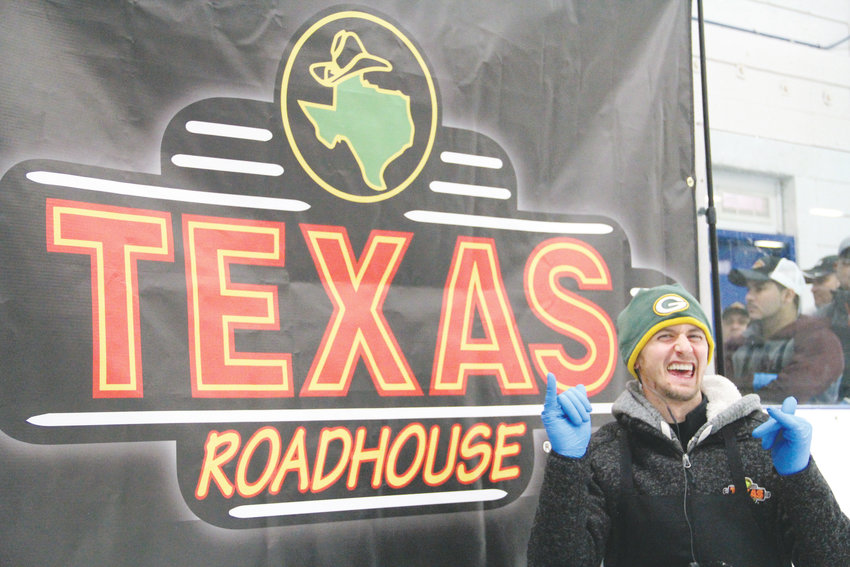 Nathan Garness, 29, poses in front of the Texas Roadhouse banner Oct. 8 at South Suburban Ice Arena. The ice rink at 6580 S. Vine St. in Centennial hosted a qualifier in the 2018 Meat Cutting Challenge for meat cutters who work at the restaurant.