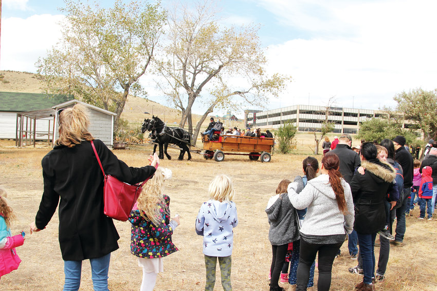 People waited in lengthy lines for hay rack rides on horse-drawn wagons at the Schweiger Ranch Fall Festival.