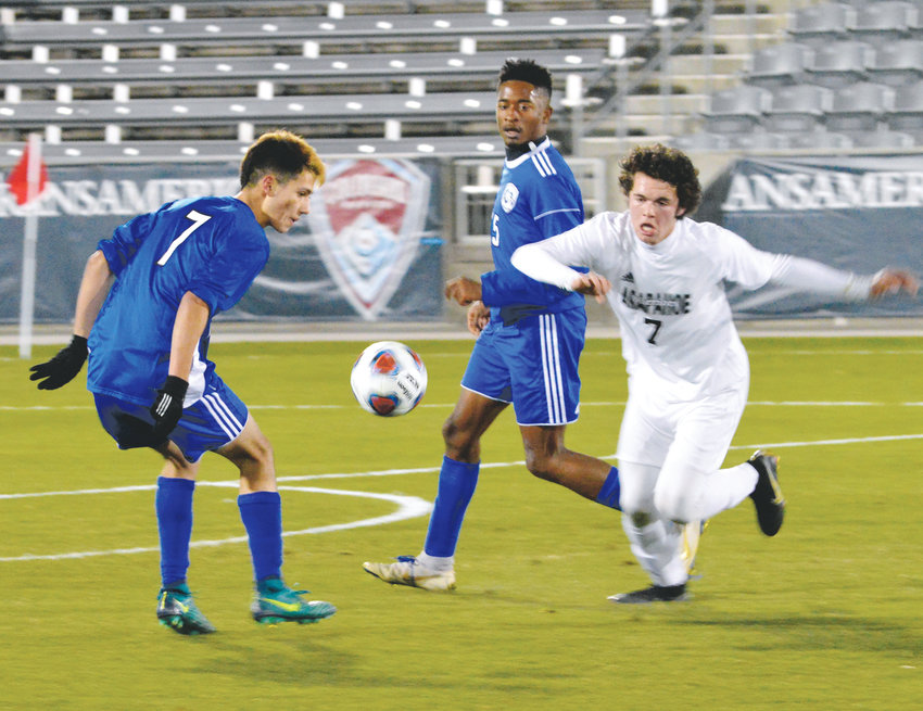Arapahoe's Cameron Gail (7) and Jose Raya (7) of Grandview track down a loose ball during the 5A state championship game Nov. 9 at Dick's Sporting Goods Park. Gail assisted on the winning goal as the Warriors downed the Wolves, 2-1.