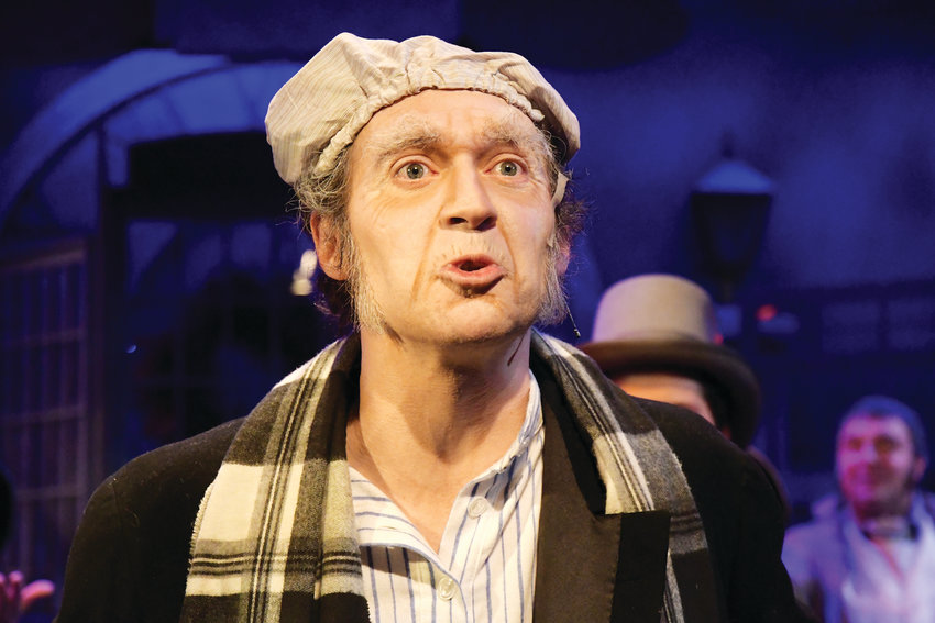 “Humbug!” Stephen Turner performs as Ebenezer Scrooge in Town Hall’s “A Christmas Carol: The Musical.”