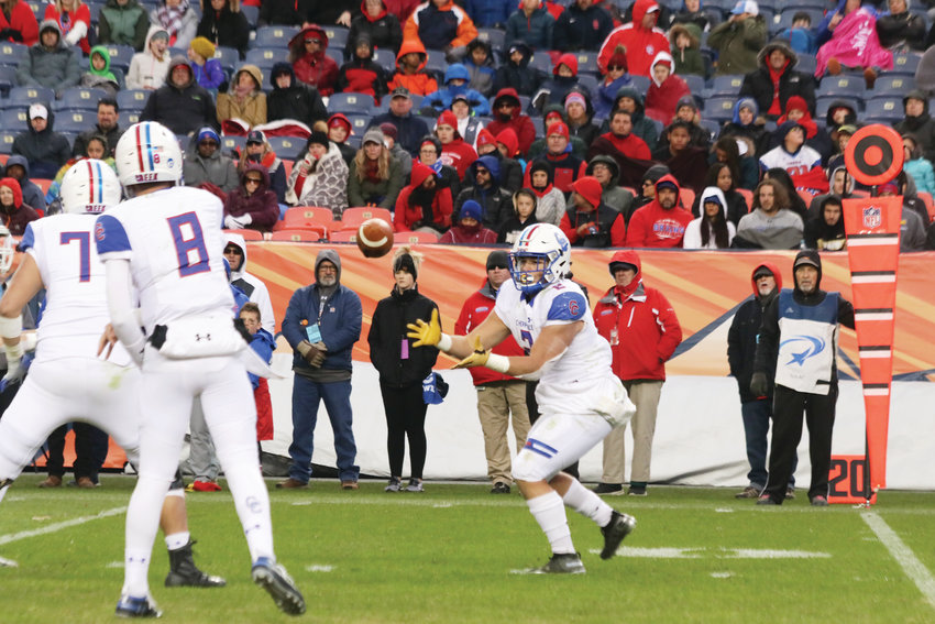 Cherry Creek quarterback Alex Padilla throws a swing pass to running back Jayle Stacks during the Dec. 1 Class 5A state championship football game against Valor Christian.