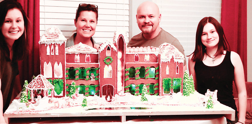 The Smith family of Castle Rock stands with their Great Gatsby-themed gingerbread house. It will be on display at the Colorado Christmas Adventure event, which takes place Dec. 7-8 at Mission Hills Church Littleton Campus, 620 Southpark Drive.