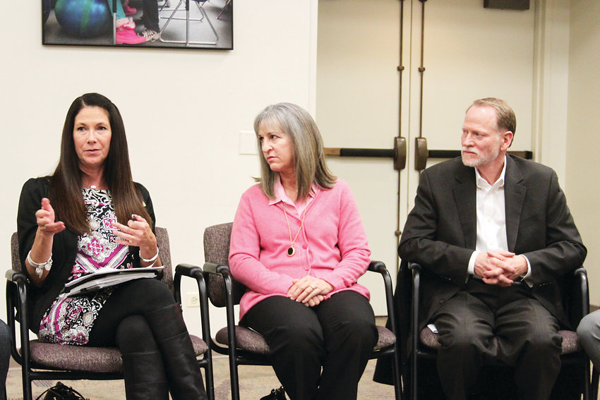 Arapahoe High School principal Natalie Pramenko, left, speaks at a Littleton Public Schools roundtable on Dec. 10. Next to her are Desiree and Michael Davis, whose daughter Claire was killed by a classmate in 2013.
