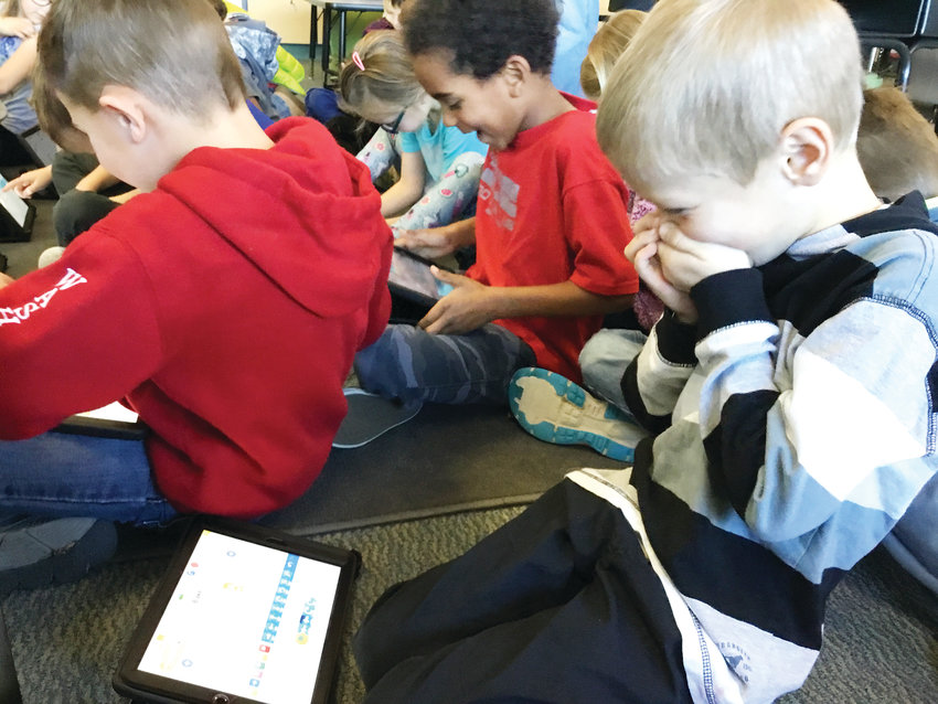 Blake Devitt, a first-grader at Fairmount Elementary School in Golden, and his fellow classmates get excited as they realize their accomplishments during a coding activity in the school’s STEM classroom led by teacher Angie Blomquist on Dec. 20, 2018.