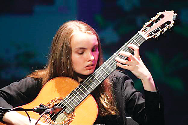 Young guitarist Gwenyth Aggeler and her instructor, Master Guitarist Alex Komodore will perform in a free concert at 7:30 p.m. Feb. 8 at Littleton United Methodist Church.