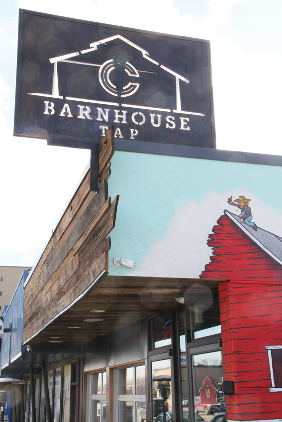 The sign at Barnhouse Tap, a bar on South Broadway in Englewood. The business near Quincy Avenue hopes to be part of a positive wave of redevelopment on that part of the Broadway corridor.