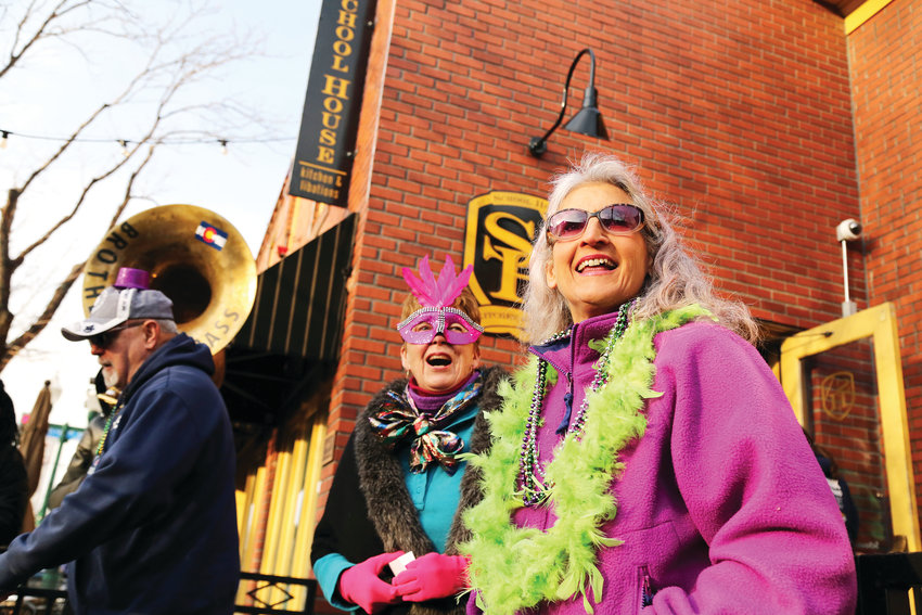Lynn Laidig and Marty Jewell celebrate Mardi Gras in Olde Town Arvada March 5.