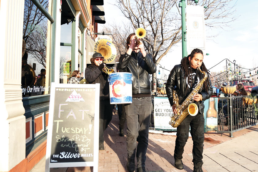 Brothers of Brass band led a Fat Tuesday parade in Olde Town March 5.