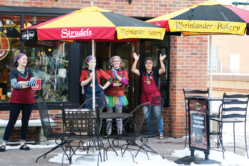 Maro Dimmer and staff at Rheinlander Bakery came out to feel the music during the Fat Tuesday Parade.