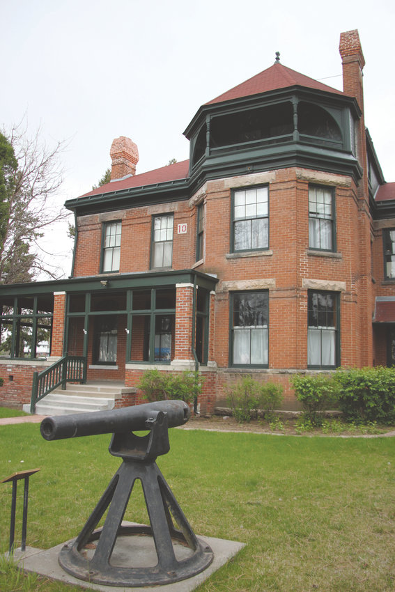 Fort Logan’s “salute gun,” which dates to the Civil War, sits in front of the Field Officer’s Quarters, which today houses the fort museum.