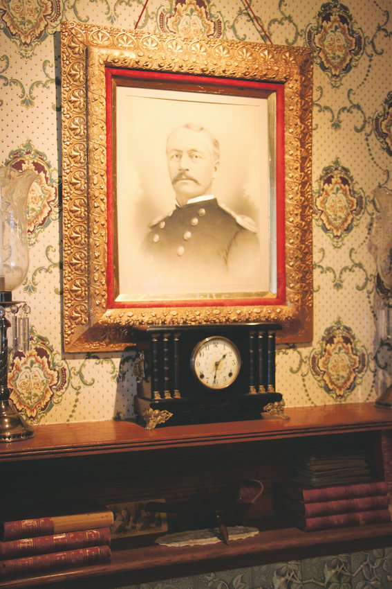 A portrait of Col. Henry Merriam, Fort Logan’s longest-serving commander, hangs over the fireplace in the fort museum.