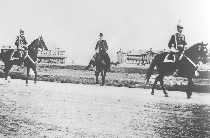 Col. Merriam, right, and two other officers on Fort Logan’s parade ground toward the end of the 19th century.