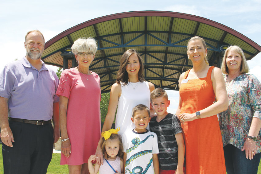From left, former Arapahoe County Commissioner John Brackney; former Centennial Mayor Cathy Noon; Centennial resident Shoshana Howley and her kids, 2-year-old Serena, 5-year-old Remington and 7-year-old Dylan; Centennial Mayor Stephanie Piko; and Centennial resident Jill Meakins stand June 14 at Centennial Center Park. Located along East Arapahoe Road next to city hall, the park serves as a near-midway point in the city.