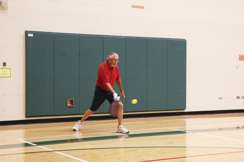 George Wiggins serves during a July 25 pickleball game at Malley Senior Recreation Center. The game is played by all ages and is reported to be the fastest growing game in the country.