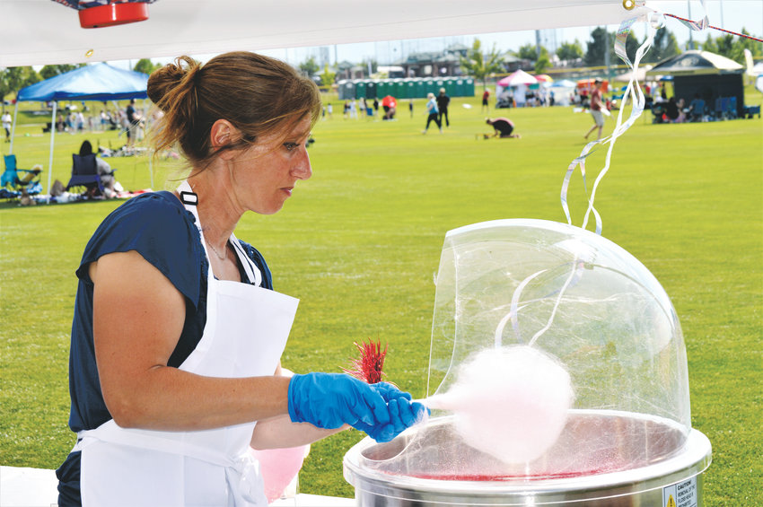 Dawn Ciciulla of Simple Spun Cotton Candy works her magic at Westminster’s Fourth of July Celebration at Westminster’s City Park.