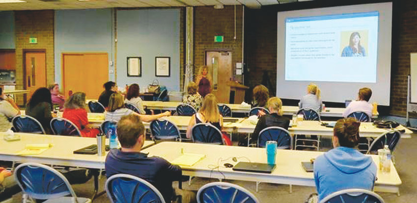 Mary Landerholm, an action plan manager for the Laboratory to Combat Human Trafficking, conducts a training session about identifying human trafficking July 2017 at the Community Reach Center site in Northglenn, Colorado.