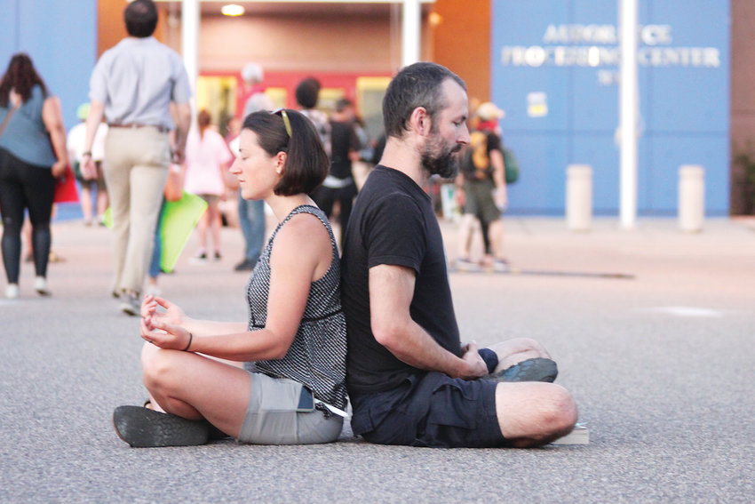 Protesters meditate outside Aurora's immigrant detention center.