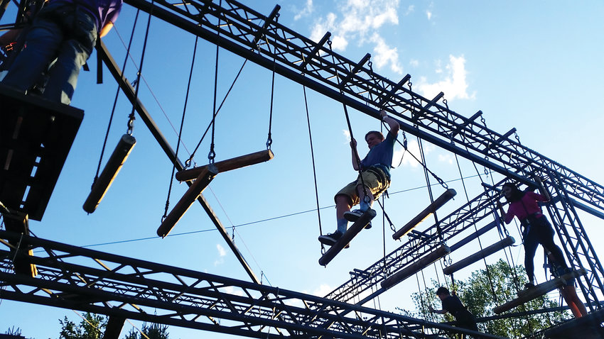 A couple of people navigate a challenge on Adventure Golf &amp; Raceway’s ropes course in 2017. People enjoy the attraction for the physical challenge, as well as to gain a sense of accomplishment.
