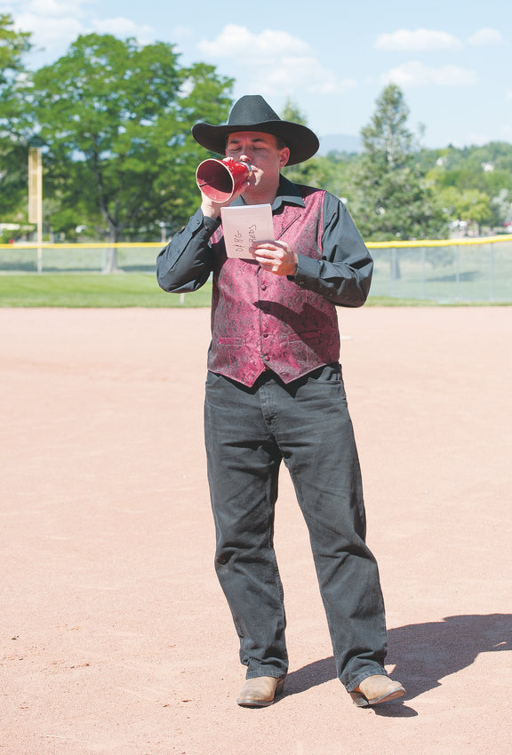 Paul Harris of Westminster announces the names of Colorado Vintage base ballists (players) prior to a game between the Star Base Ball Club of Colorado Territory, and the Lightning Bolts of Westminster July 13, at Wolff Run Baseball Park. Harris normally plays for the Denver Blue Stockings but served as the umpire in this match.