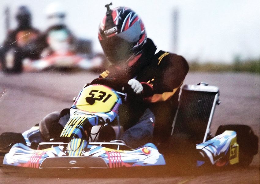 Christian Obrecht, a 47-year-old from Denver, turns his wheel in a kart race. Obrecht owns his own kart. In metro Denver and farther out, some tracks allow drivers to use their own karts.