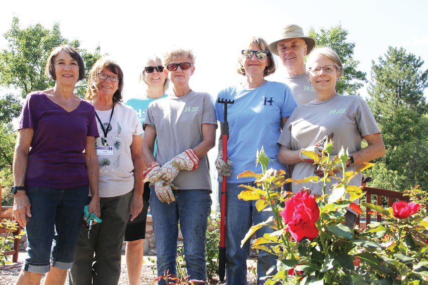 From left, volunteer gardeners Peggy Williams, Cindy Lund, Holly Penn, Cathy Pick, Terri Thomson, Dave Ingram and Karen Thurman stand at the rose garden Sept. 11 at Hudson Gardens in Littleton.