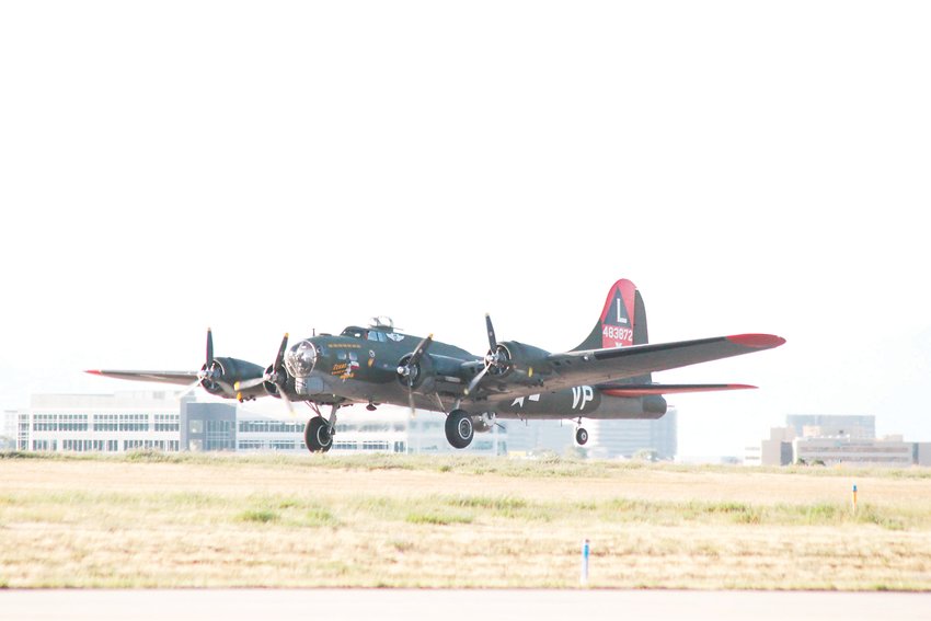 The Commemorative Air Force’s B-17, dubbed Texas Raiders, slips the surly bonds of Earth at Centennial Airport. The plane’s visit was an emotional experience for spectators.