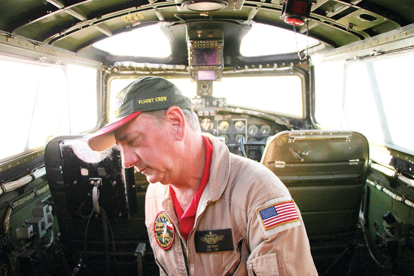 Pilot Len Root climbs into the cockpit of Texas Raiders, a restored B-17 bomber that visited Centennial Airport.