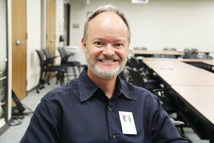 Tony Poole, assistant superintendent of special populations for Cherry Creek School District, sits at the district office building in August. Poole helps oversee mental health for the district.