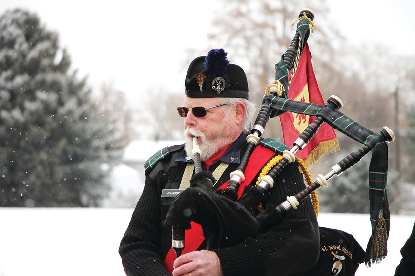 Tom Johnson, a pipe major with the El Jebel Shrine’s bagpipe band, plays Amazing Grace.