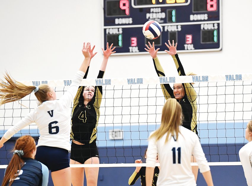 Valor Christian’s Madeline Mallory (6) sends one over the net as Rock Canyon’s Lauren Shea (4) and Taylor Holter (8) have blocks on their minds. Mallory’s Eagles needed 4 games to eliminate Rock Canyon after defeating Rocky Mountain earlier in the day to win the 5A Regional Saturday at Valor Christian.