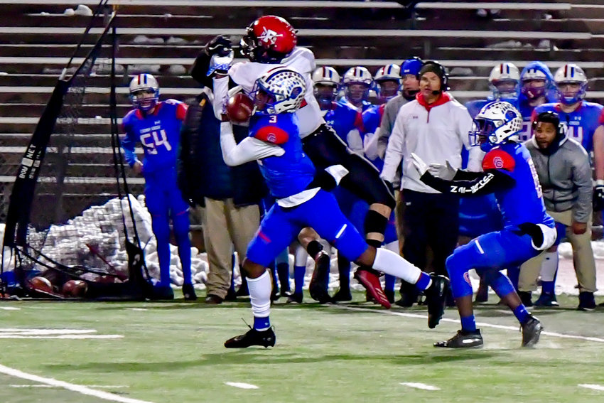 Cherry Creek junior Myles Purchase (3) intercepts a pass in the third quarter and returns it 15 yards for a touchdown in the quarterfinal playoff game against Fairview on Nov. 22 at the Stutler Bowl. Cherry Creek, down 20-7 early in the game, defeated the Knights, 42-28 and will play Pomona in the semifinals.
