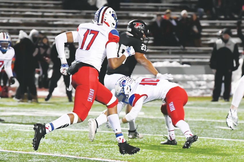 Cherry Creek's defense played a key role in the Bruins' 14-7 semifinal victory over Pomona on Nov. 30 at the Stutler Bowl. Senior safety Chavis Nourse (10), who had a fumble recovery early in the game, prepares to make a tackle on Pomona's Sanjay Strickland (25) as the Bruins' Dolonte Dickey (17) follows the action.