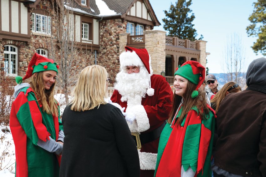 Santa and his elves greet attendees at the Highlands Ranch Mansion holiday event Dec. 7.