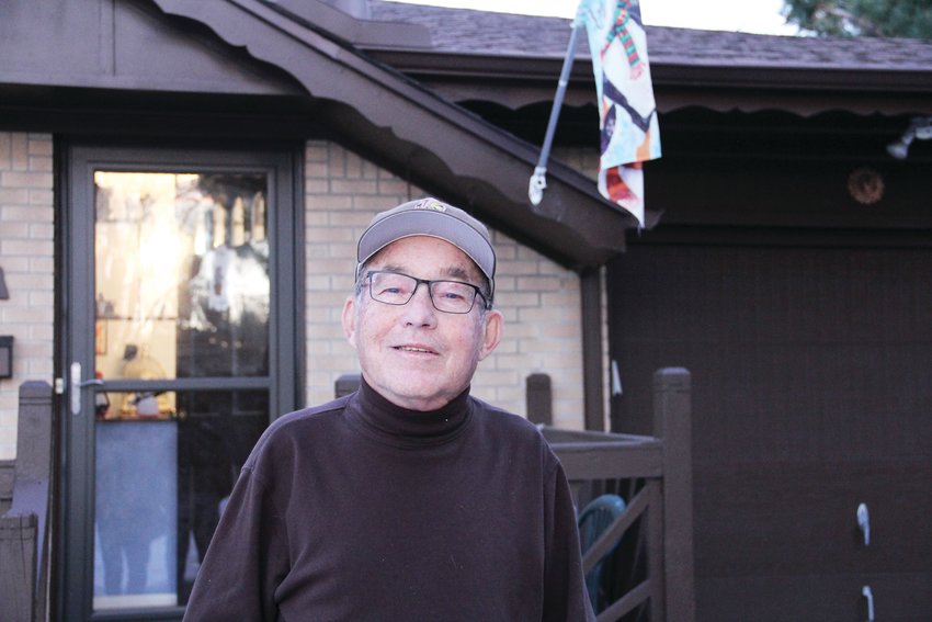 Jim Benton, a sports writer for Colorado Community Media, has been covering sports in the Denver area for more than 50 years. Here, he stands outside his longtime home in Centennial.