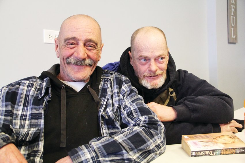 Thomas Trevithick, 59, left, and brother Timothy Trevithick, 58, sit at Giving Heart homeless-services center in Englewood at the end of an event for the Point in Time survey. They grew up in the Arapahoe High School area in what’s now Centennial.