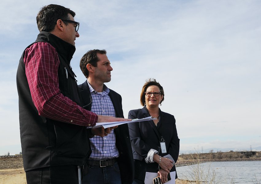 Thornton Water Treatment and Quality Manager Martin Kimmes, left, explains city water storage policies to U.S. Rep. Jason Crow, (D-Colorado 6th District) as Mayor Heidi Williams looks on, at Tani Reservoir last spring.