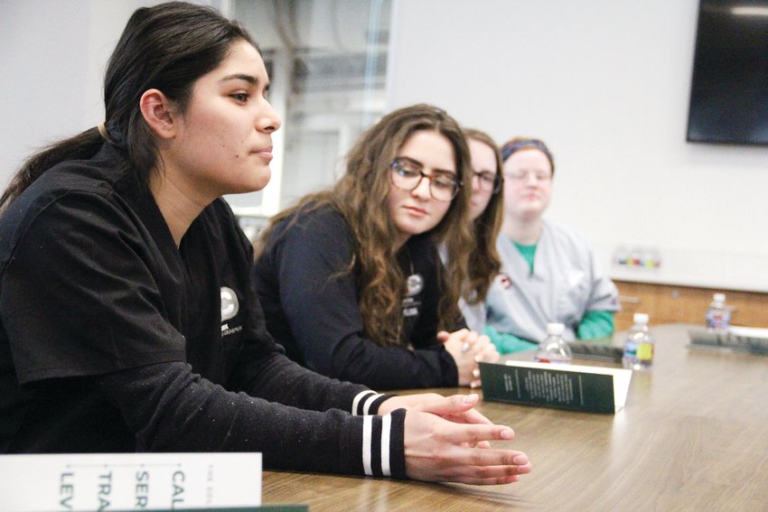 Smoky Hill High School senior Gisel Chavez, left, speaks during a Feb. 19 roundtable that discussed the mental health provider industry with U.S. Sen. Cory Gardner. Next to Chavez, from left, were Cherokee Trail High senior Milana Yushkevich, Smoky Hill senior Adrianna Fitzgerald and Cherry Creek High senior Harper Hanson.
