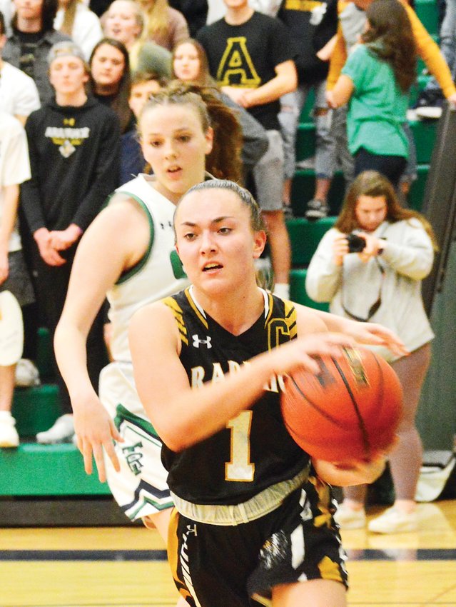 Arapahoe’s Kali March drives along the baseline during the Feb. 28 second-round girls state basketball playoff game against ThunderRidge. March scored 15 points for the Warriors, who outscored the Grizzlies 15-5 in the fourth quarter to pull off a 43-32 win.