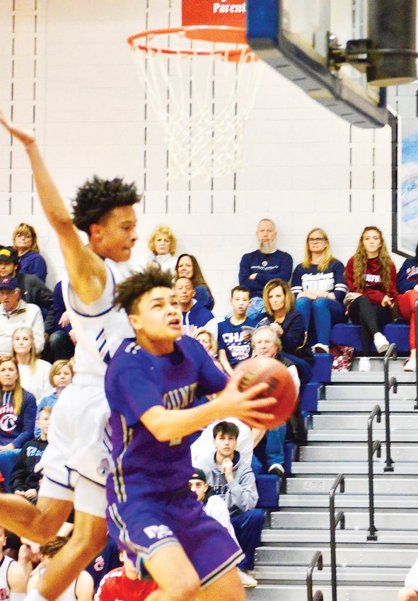 Douglas County’s Jaeton Hackley drives in for a layup and he scored 20 points to lead the Huskies, who suffered a 91-64 loss to Chaparral on Feb. 29 in a second-round Class 5A state playoff game.