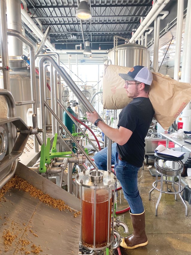 Wild Blue Yonder Brewing Co. Assistant Brewer Garet Clever gets ready to brew the Castle Rock brewpub's next batch of Colorado Cool-Aid IPA on March 17.