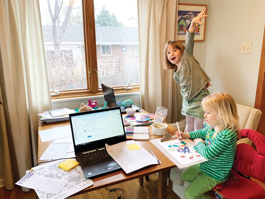 Herrin's daughters Mae, 6, who attends Stober Elementary, and Ellis, 4, who is in preschool at St. Joan of Arc, work from home during the remote learning plan.