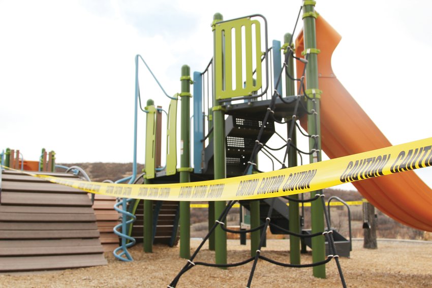 Playgrounds at Philip S. Miller Park in Castle Rock are taped off, although the park remains open to people if they properly socially distance.