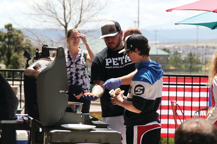 Supporters of C&amp;C Coffee and Kitchen pulled up a grill to the Castle Rock location on May 12 and served up free food.