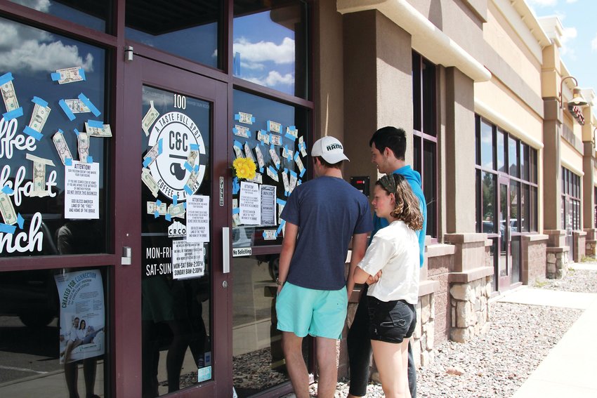 A steady stream of people stopped by C&C Coffee and Kitchen on May 12. Some hoped to order food and found the restaurant closed. Others taped cash donations to the storefront. A few came simply to see the spectacle.
