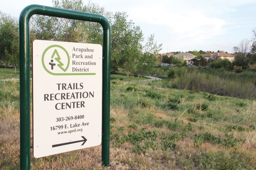An Arapahoe Park and Recreation District sign along a path that leads to Trails Recreation Center in Centennial, May 19. The district oversees parks, trails and that rec center in the east Centennial area.