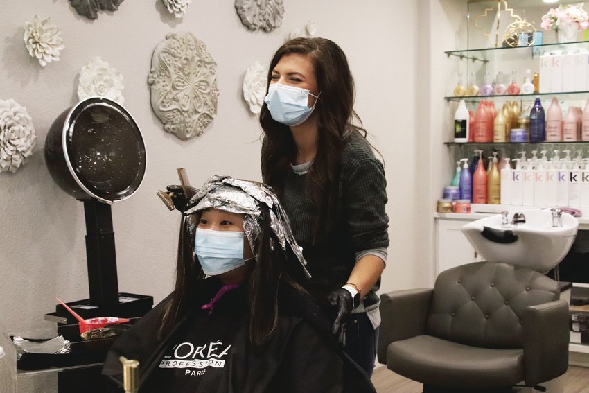 Roots and Mane salon in Lone Tree reopened May 14. The salon has taken social distancing measures and required stylists to wear masks.
