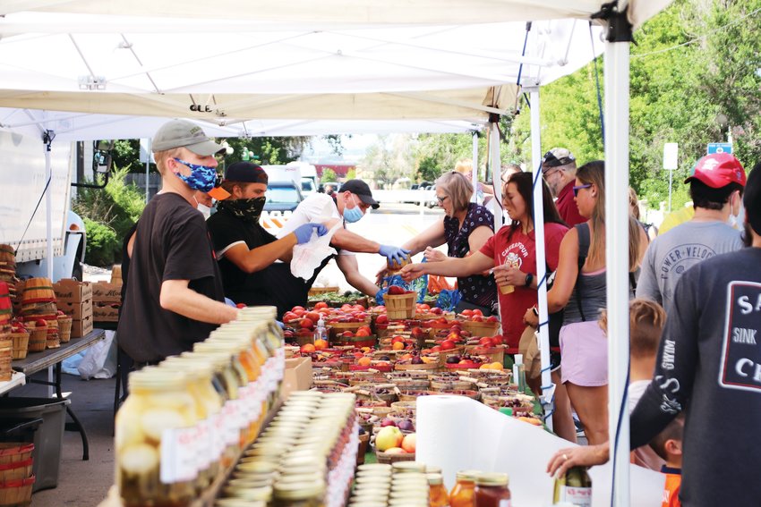 The Parker Farmers Market has been open since June 7 with some changes to accommodate social distancing practices. Most wore masks and people generally respected each other’s space. Vendors handled their own produce and no in-person samples are allowed.