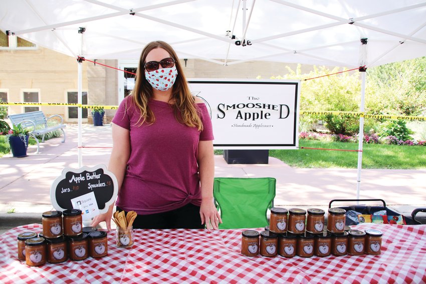 Staci Mann, of Parker, can't provide samples of her apple butter at this year's farmer's market, but she said it hasn't interfered with her business, the Smooshed Apple, so far. "I've had people ask for samples, but people that know they like the product or apple butter in general, they just want to buy anyway without sampling." Mann sells various products at farmer's markets and festivals and said though her business selling apple butter and lollipops hasn't dipped, the mass cancellation of summer festivals has hurt her business selling art prints. "A festival, where I'll make a month's worth of income in a day--so I have to account for that loss of income."
